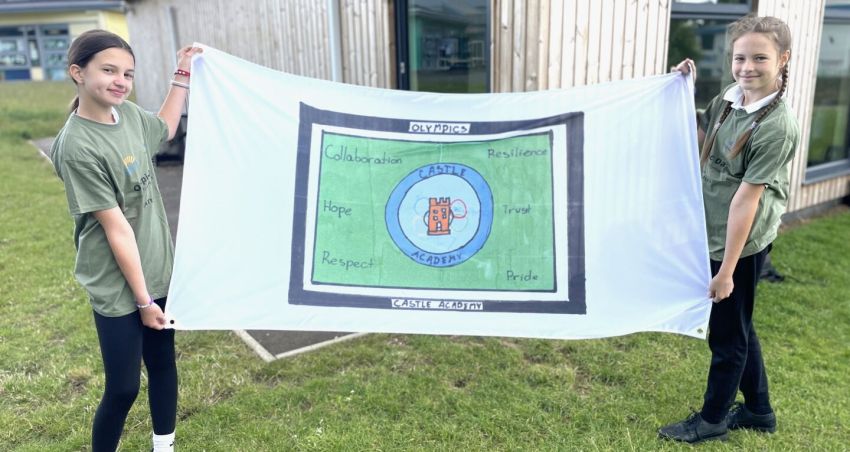Pupils’ winning designs become their schools’ Olympic flag!
